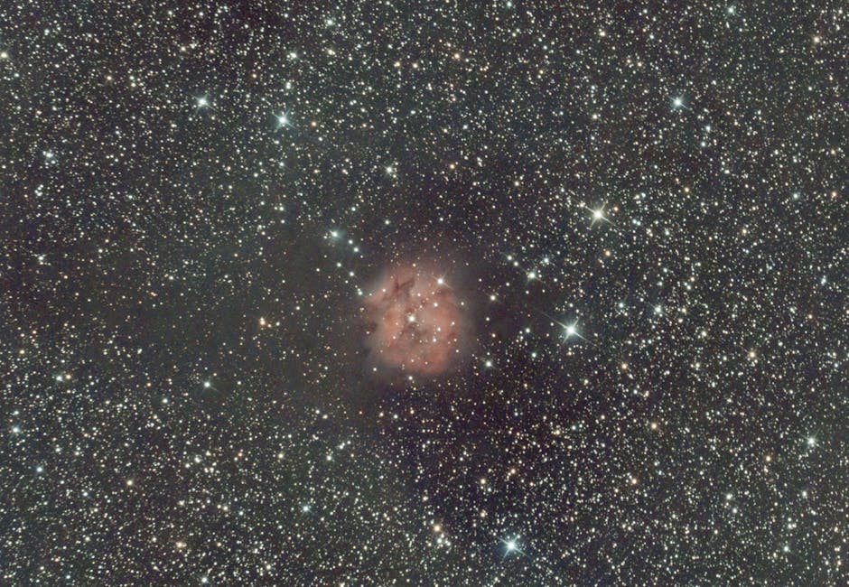 A breathtaking view of the Rosette Nebula surrounded by countless stars in the night sky.