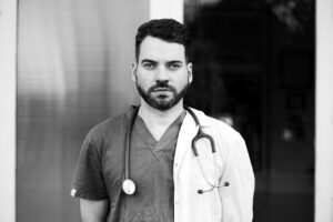 Free stock photo of black and white doctor, classic monochrome look, clinical environment