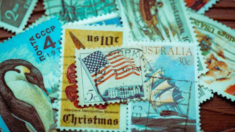 A vibrant, close-up photo of various vintage postage stamps from around the world, featuring diverse designs.