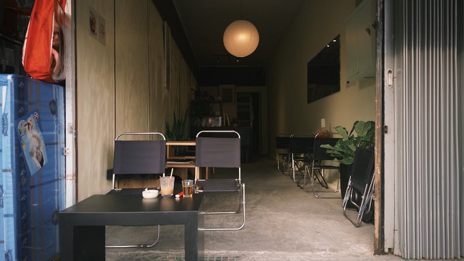 Inviting small café with an open seating area, modern decor, and natural lighting.